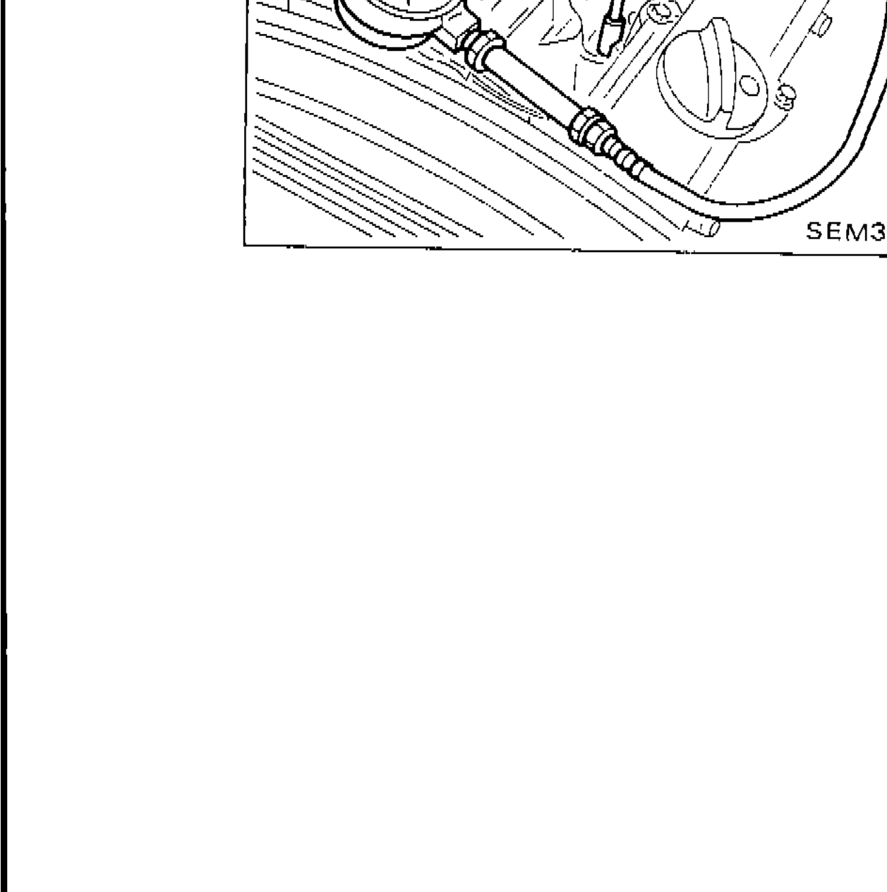 Photo showing a compression tester attached to a cylinder spark plug hole