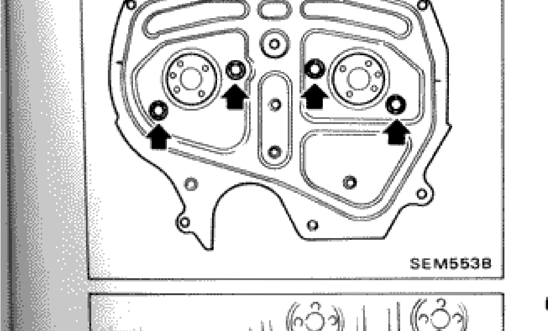 Rear timing cover installation showing arrow indicators for proper installation
