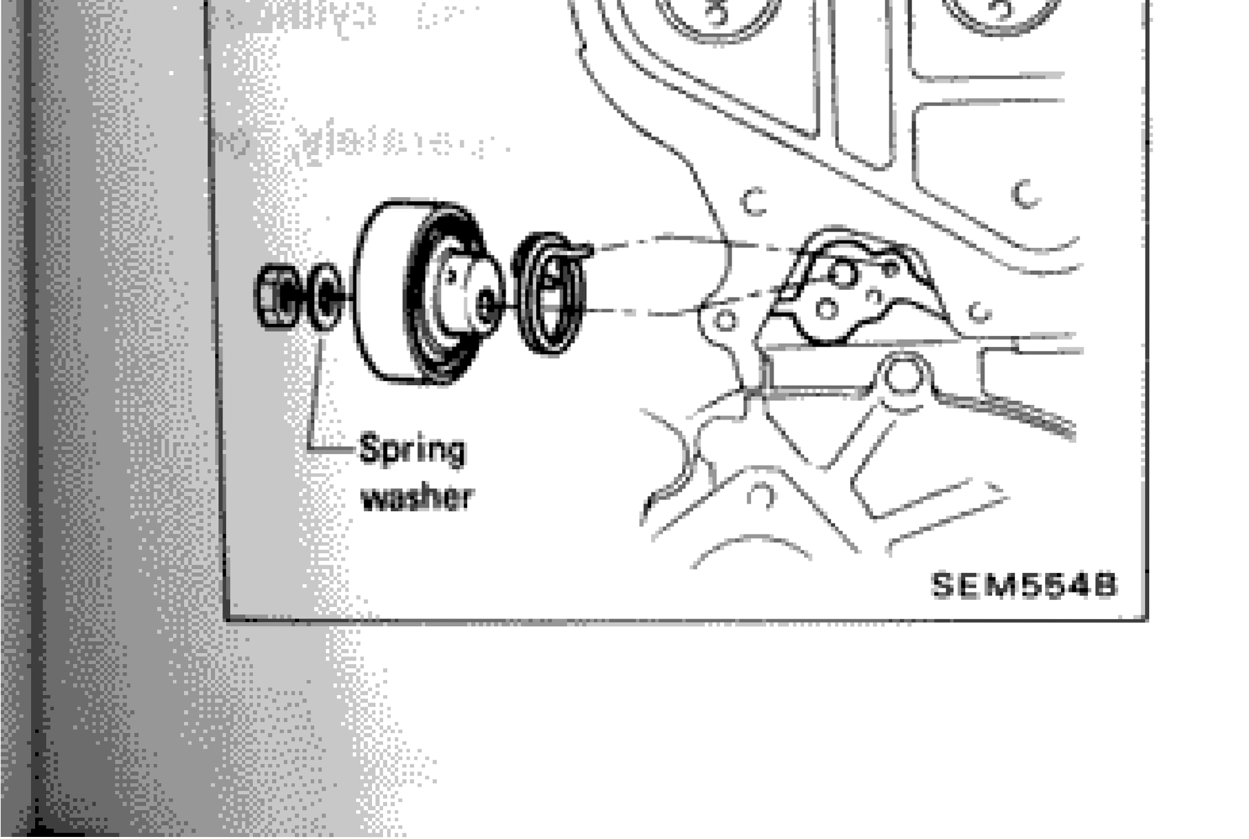 Timing belt tensioner installation showing spring washer location