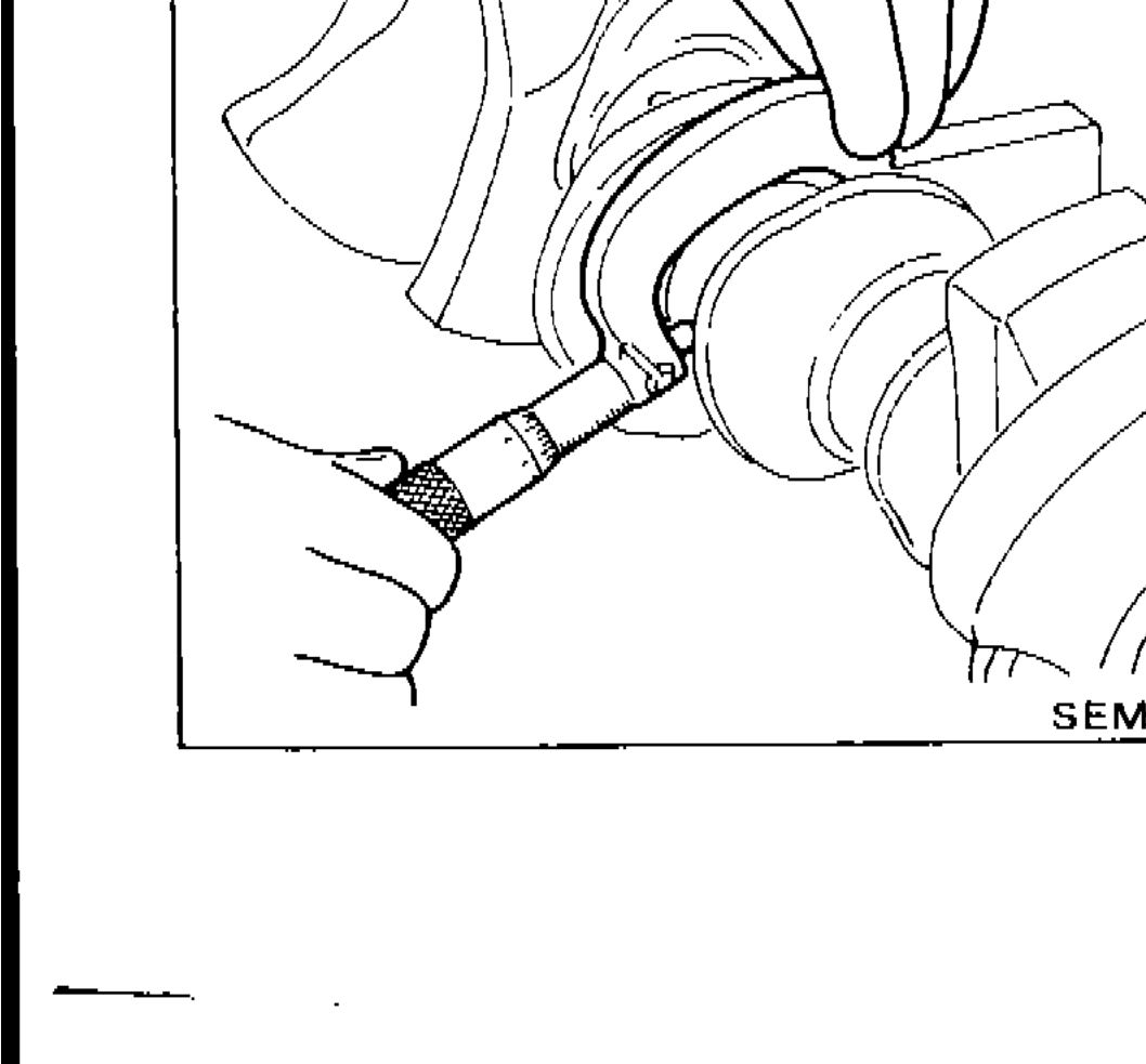 Micrometer measuring outer diameter of crankshaft main journal