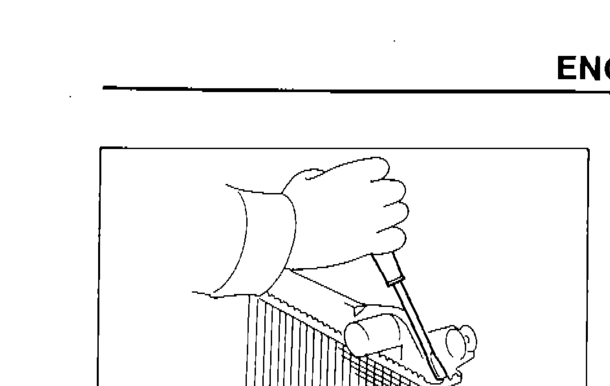 Hand using a screwdriver to bend the edge of the radiator tank up