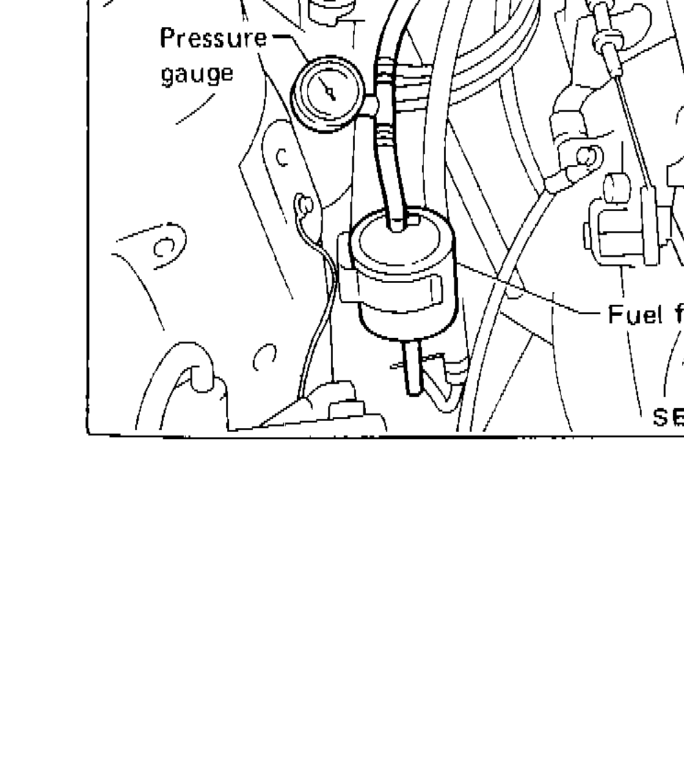 Engine bay photo showing pressure gauge and fuel filter installation location