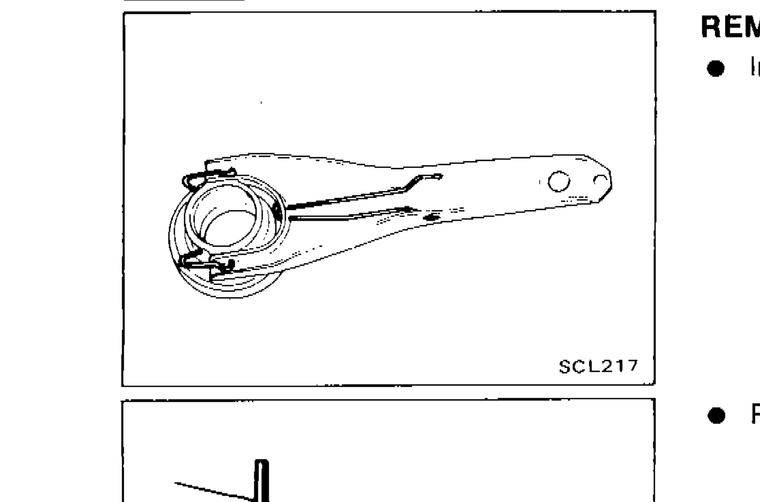 Photo showing withdrawal lever with release bearing assembly, illustrating installation of retainer spring and holder spring.