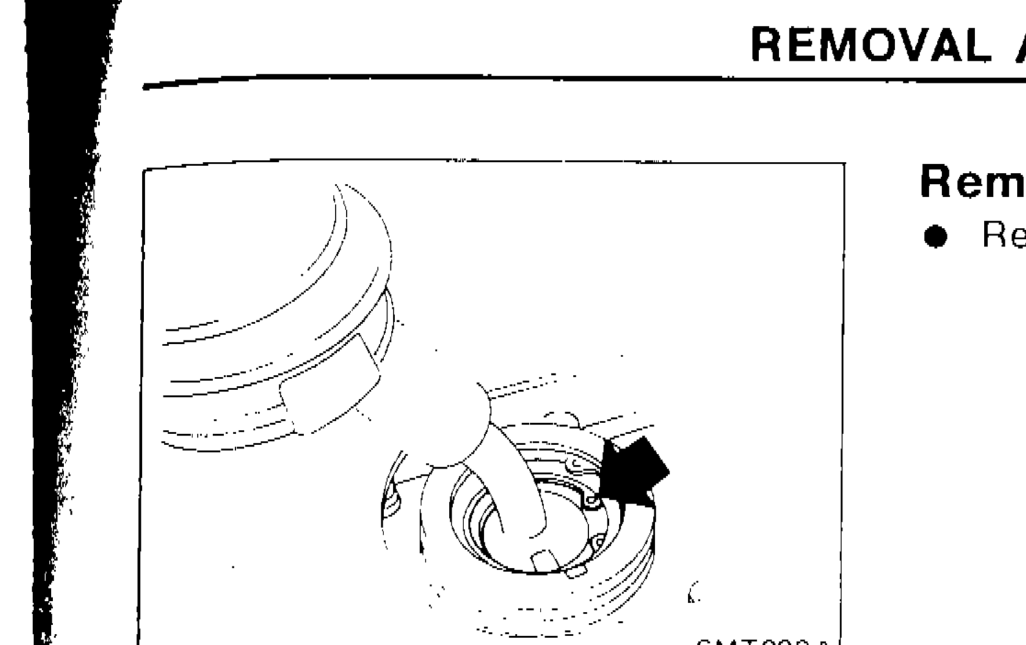 Photograph showing removal of shift lever from inside vehicle