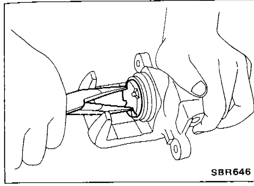 Long-nose pliers turning the rear-caliper piston counter-clockwise to back it out of the cylinder body.